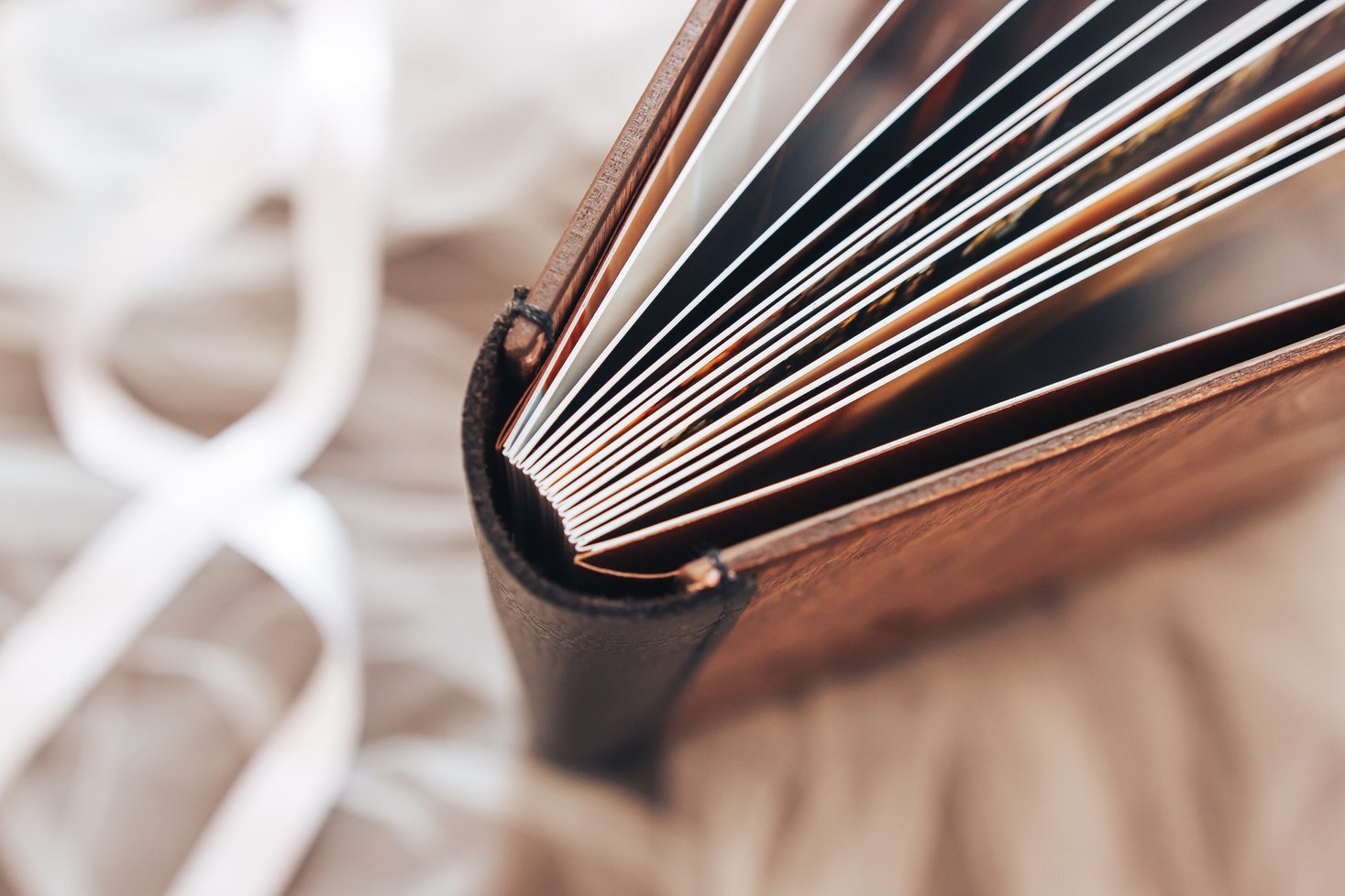 Leather binding of a wooden photo book. Leather binding photo book made of wood. Note book with hard wooden cover.